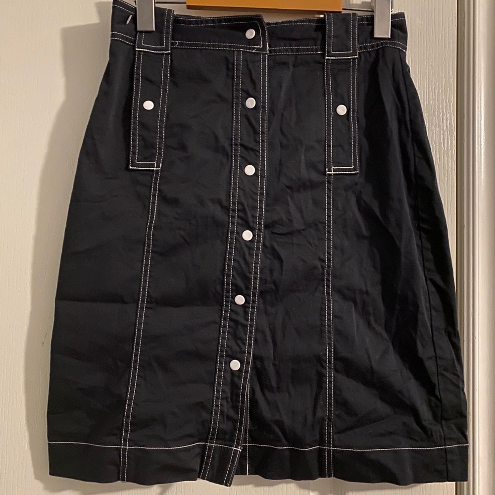 Black skirt with white buttons